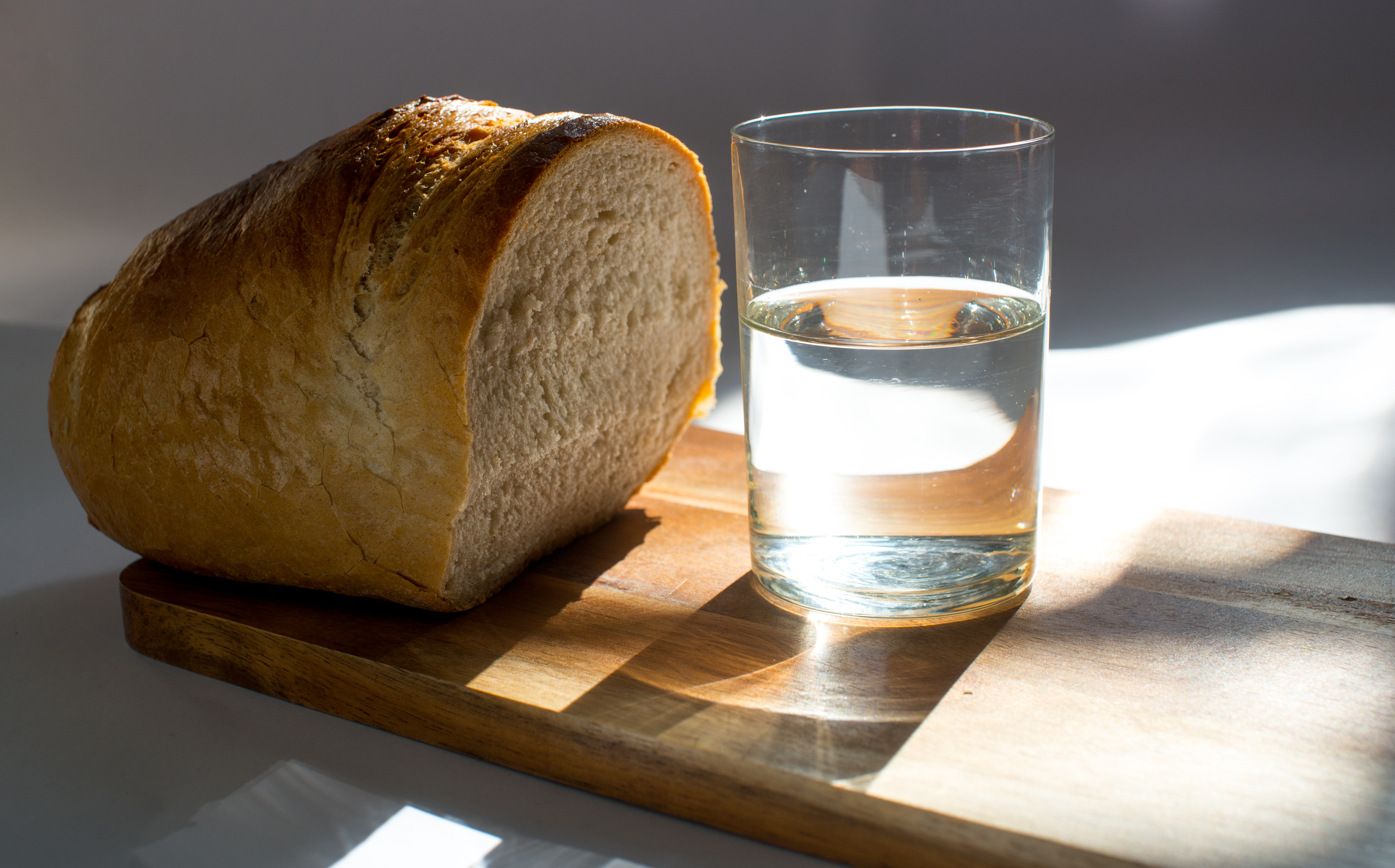 Loaf of break and glass of water