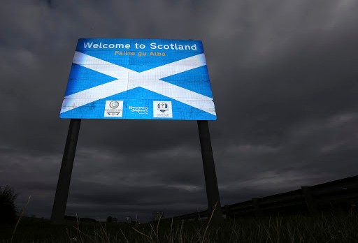 sign welcoming motorists to Scotland