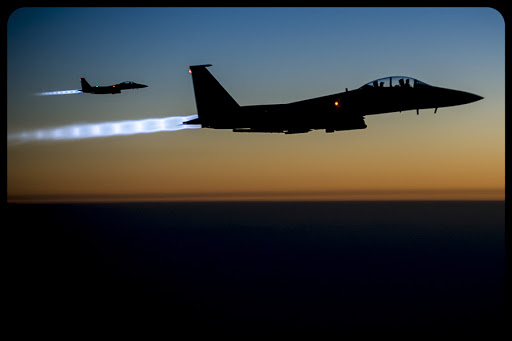 Two U.S. Air Force F-15E Strike Eagle aircraft fly over northern Iraq Sept. 23, 2014, after conducting airstrikes in Syria