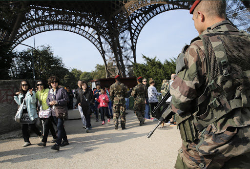 Soldiers patrol Eiffel Tower