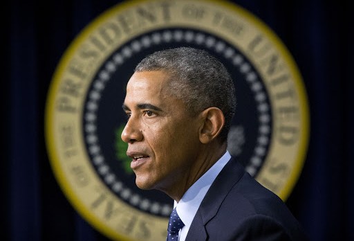 President Obama in front of presidential seal
