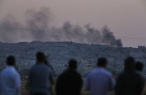 Turkish Kurds watch airstrikes in Kobani, Syria