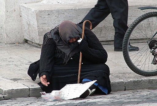 Beggar outside St. Peter&#8217;s in Rome