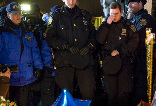 Mourners at spot where NYC cops killed