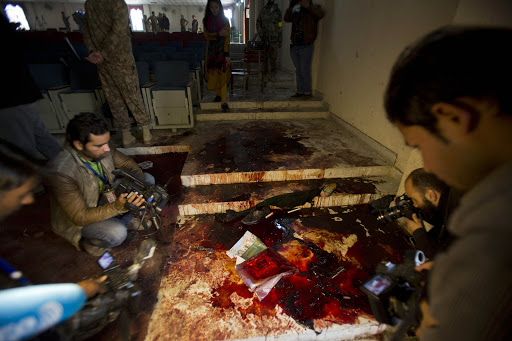 Journalists in Pakistan school after massacre of students