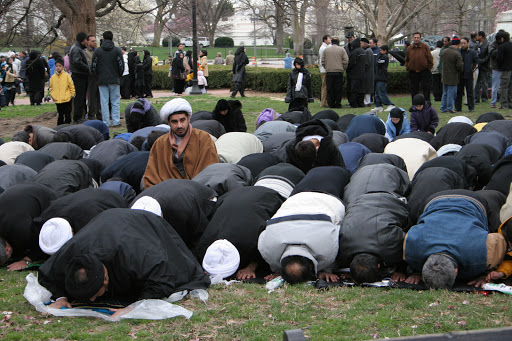 Muslim men pray in Franklin McPherson Square in Washington DC