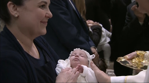 Pope Francis baptizes infants