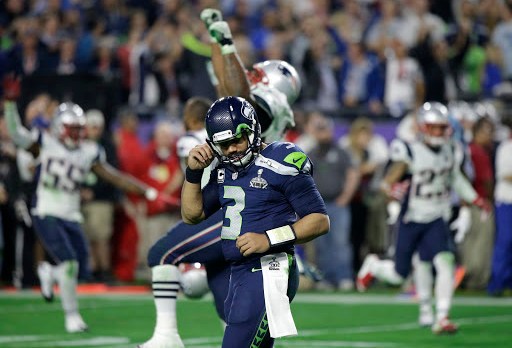Seahawks q-back Russell Wilson reacts after throwing interception