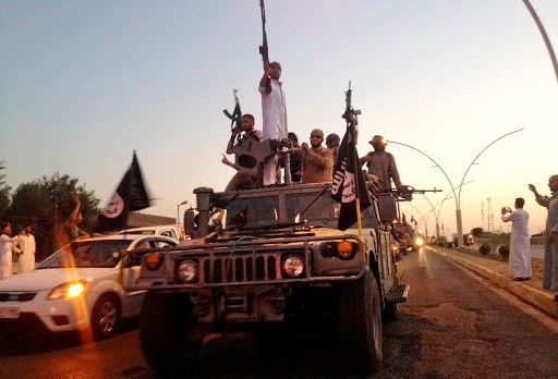 Islamic State fighters parade thru Mosul June 2014