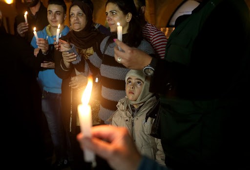 Palestinians pray for Syrians Christians