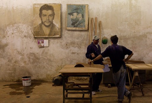 Cuban workshop with Fidel Castro photo on wall