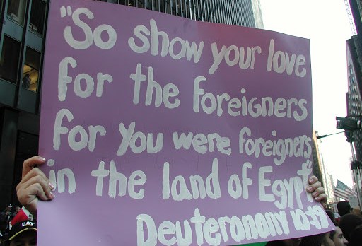 Sign at immigrant rally quotes Deuteronomy