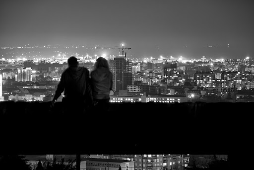Couple dating overlooking big city