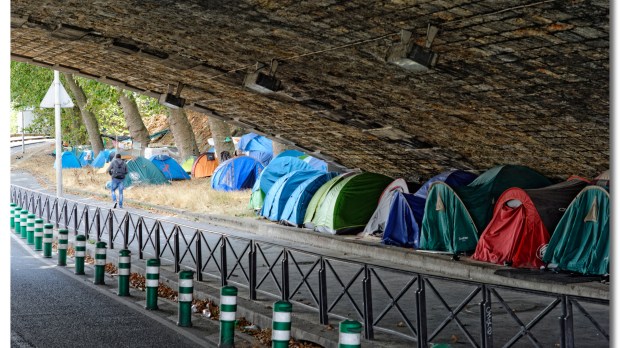 Migrant tents under a bridge in Europe
