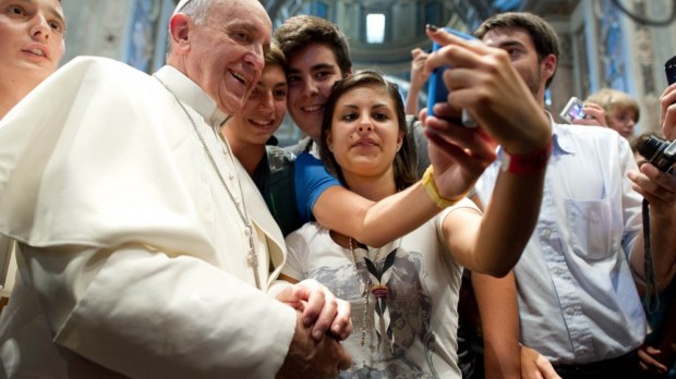 Pope Francis taking selfie with teens