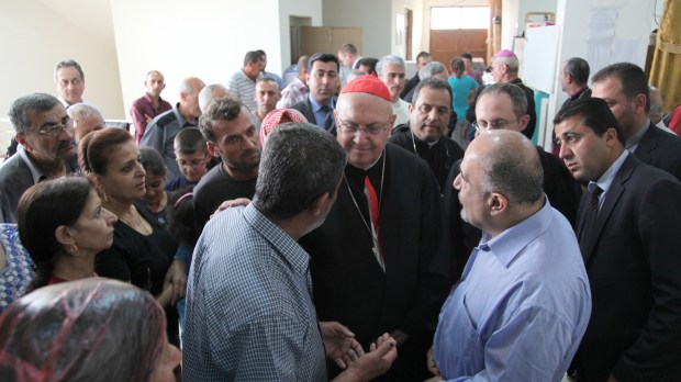 Cardinal Leonardo Sandri speaks with displaced people in Iraq