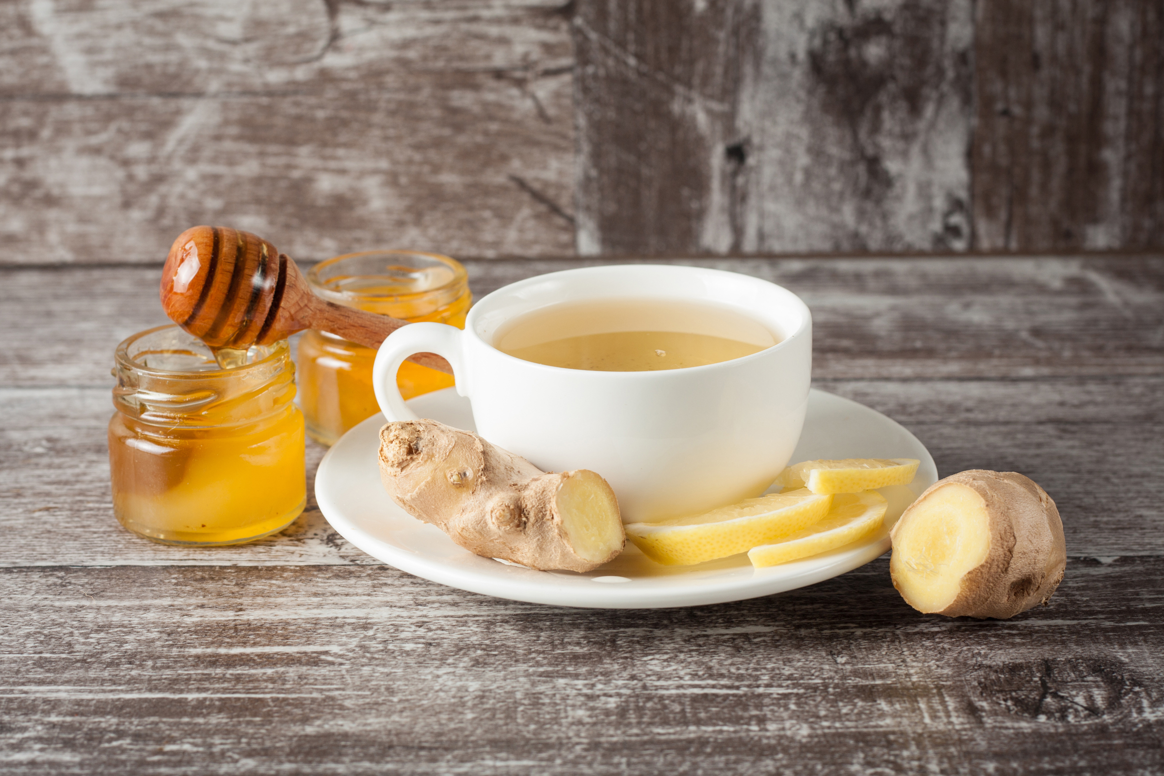 http://www.shutterstock.com/pic-332345660/stock-photo-a-white-cup-of-green-natural-tea-with-ginger-lemon-and-honey-on-wooden-rustic-background-healthy.html?src=UvaLLrjuu8mbTnIYccf9dQ-1-7