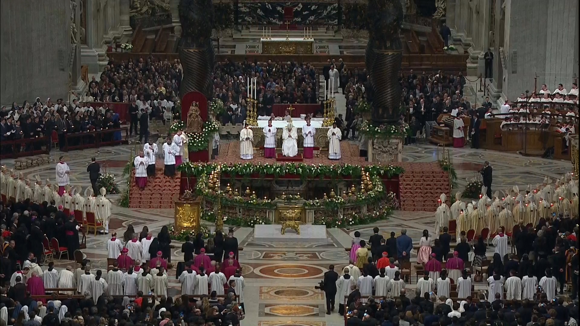 High altar in St. Peter's fully illuminated for Easter Vigil.