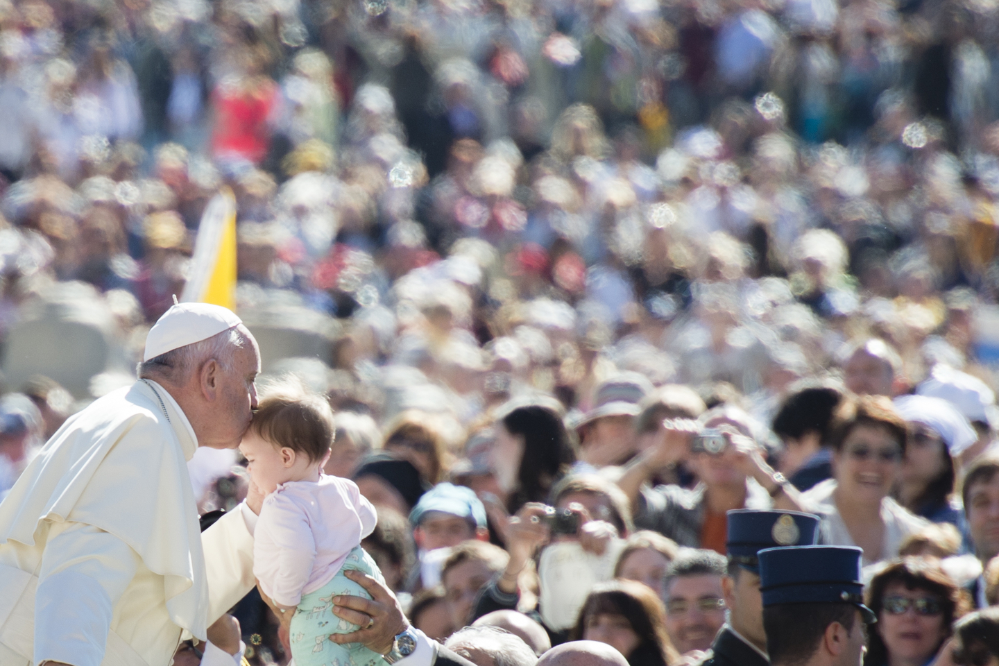 Pope Francis kisses a baby