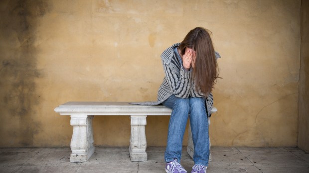 WEB-YOUNG-GIRL-SUICIDE-DEPRESSED-SITTING-CRYING-Paulius-Brazauskas-Shutterstock_113619055