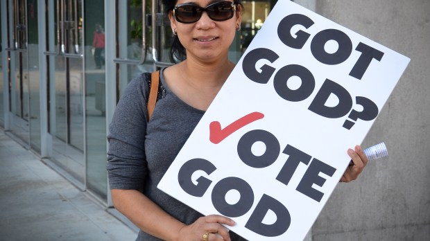 WEB-GOT-GOD-VOTE-SIGN-WOMAN-Steve-Rhodes-CC