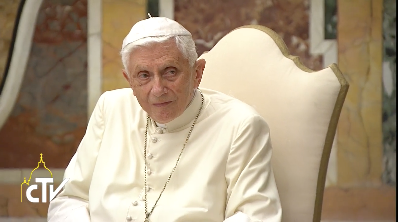 Pope Benedict listening to Pope Francis