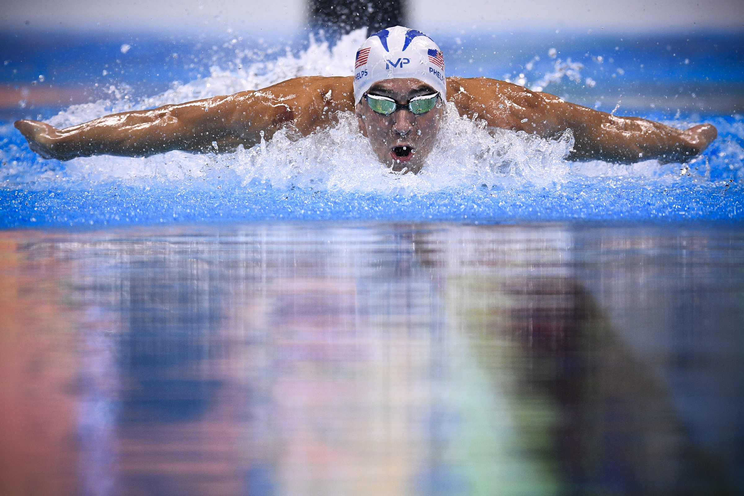 USA's Michael Phelps competes in a Men's 200m Individual Medley heat during the swimming event at the Rio 2016 Olympic Games at the Olympic Aquatics Stadium in Rio de Janeiro on August 10, 2016.   / AFP PHOTO / Martin BUREAU