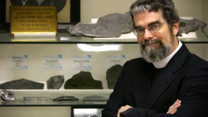 December 12, 2005: U.S. Jesuit Brother Guy Consolmagno, an astronomer with the Vatican Observatory, is pictured with the observatory’s meteorite collection, in the headquarters of the Vatican Observatory in Castel Gandolfo.