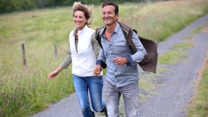web-happy-middle-aged-couple-running-goodluz-shutterstock_196238294