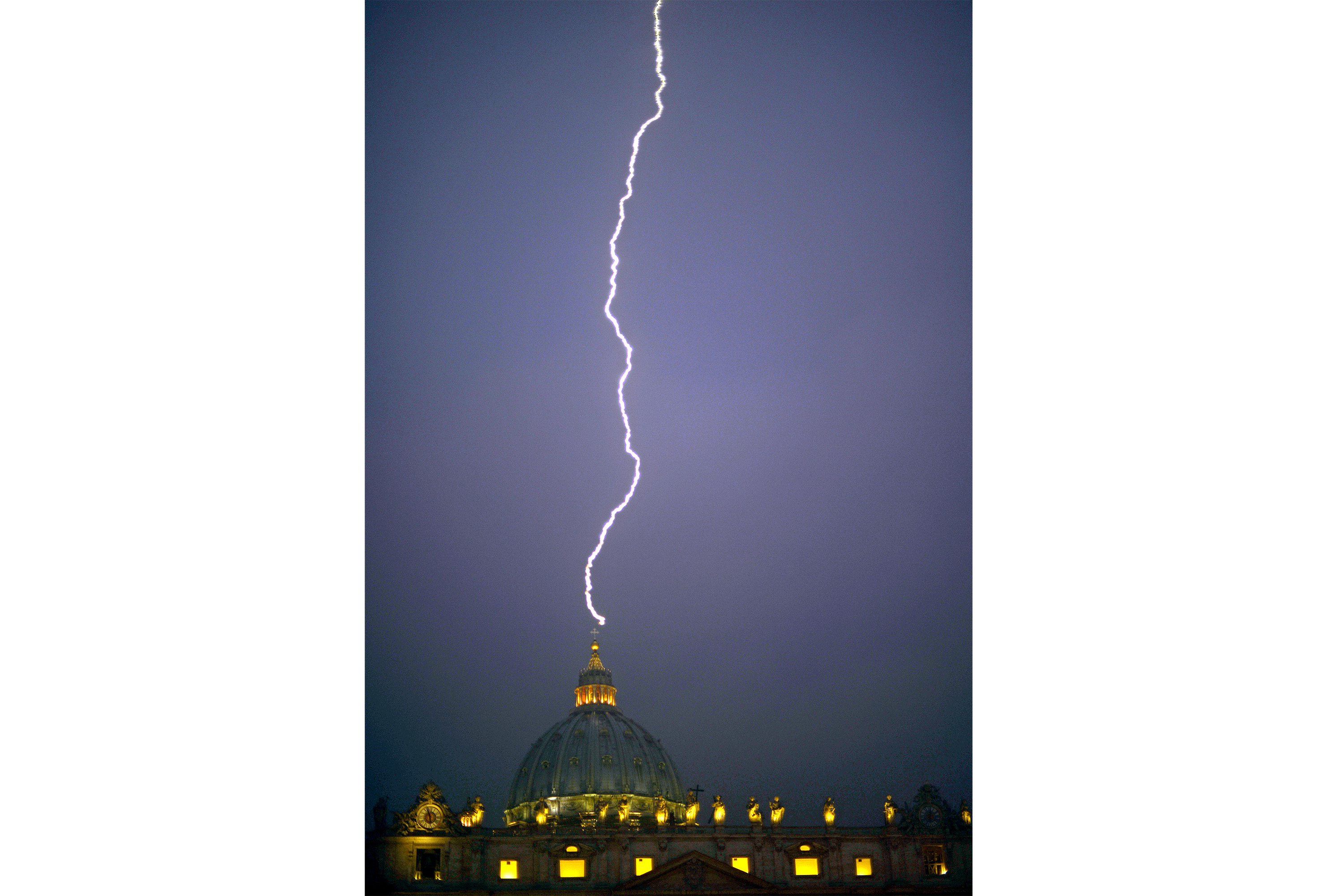 Lightning strikes St Peter's dome at the Vatican on February 11, 2013. AFP PHOTO / FILIPPO MONTEFORTE / AFP PHOTO / FILIPPO MONTEFORTE