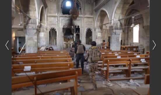 Iraqi coalition forces inspect church in liberated town of Bartella