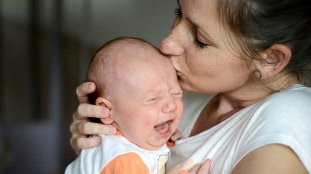 web-infant-crying-baby-mother-kiss-halfpoint-shutterstock_417498310