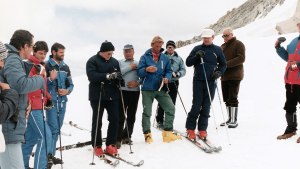 7/17/1984-Adamello Mountain, Italy: The Pope says a prayer, flanked by ski instructors, before beginning a run, 7/17.