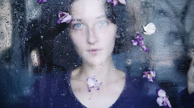web-woman-window-rain-flower-purple-yunaco-shutterstock_181398650