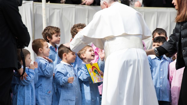 Pope Francis poses with children