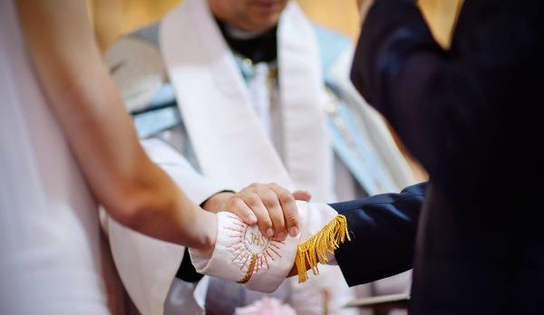 web-catholic-wedding-ihs-hands-mn-studio-shutterstock_333224522-1