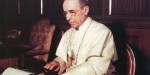 Pope Pius XII writes one of his wartime Christmas radio messages using a typewriter at the Vatican in this undated photo.