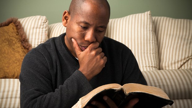 web-bible-man-reading-praying-edward-lara-shutterstock_121363582
