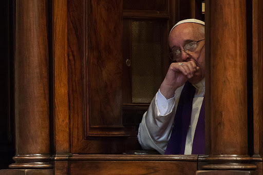 Pope Francis sitting in a confession booth &#8211; AFP &#8211; fr