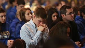 PRAYING AT MASS