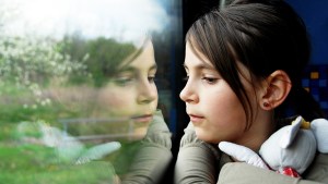 WEB3-CHILD-GIRL-STUFFED-ANIMAL-TRAIN-TRAVELLING-REFLECTION-shutterstock_76053049-Shutterstock