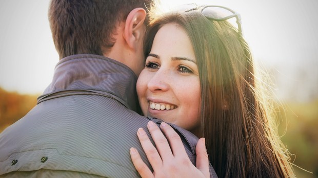 WEB3-COUPLE-FAMILY-FRIENDS-HUG-SMILE-SUNSET-HAPPY-WOMAN-Petrenko-Andriy-Shutterstock