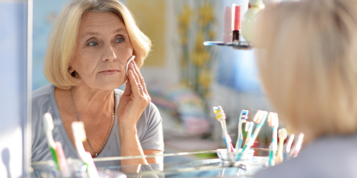 WEB3 MIDDLE AGED WOMAN SKIN CARE GRANDMA BATHROOM MAKEUP Shutterstock