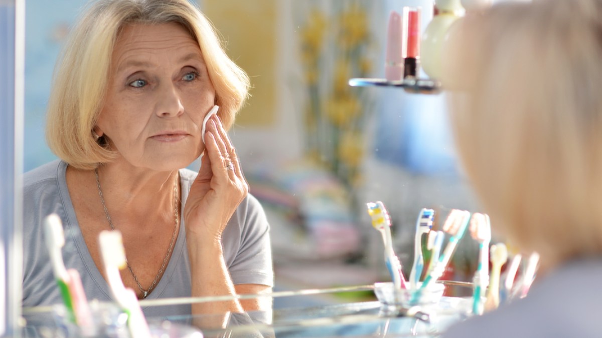 WEB3 MIDDLE AGED WOMAN SKIN CARE GRANDMA BATHROOM MAKEUP Shutterstock