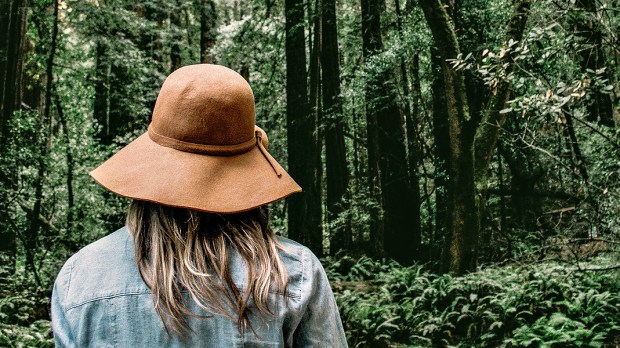 WEB3 WOMAN FOREST HIKING HAT TREES Caleb Jones Unsplash