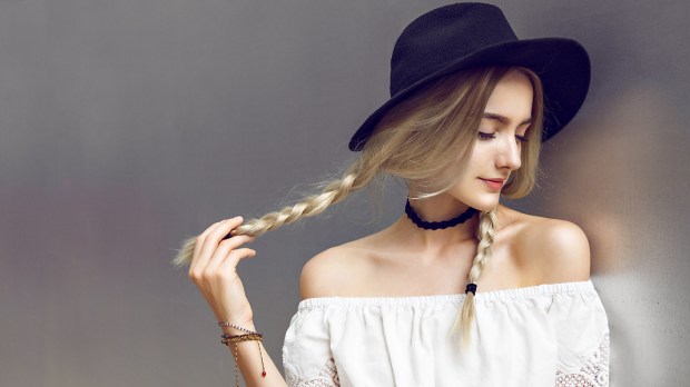 WEB3 YOUNG WOMAN WHITE SHIRT BLONDE PIGTAILS CHOKER NECKLACE FASHION Shutterstock