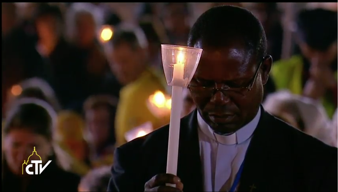 Priest at blessing of candles, Fatima