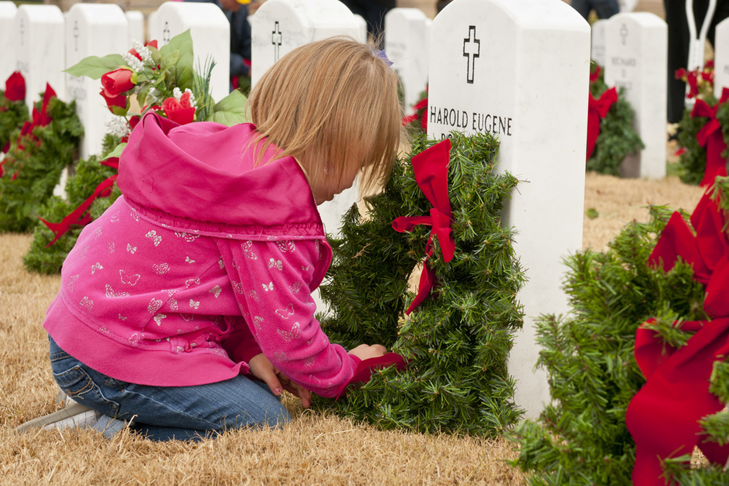 YOUNG GIRL AT GRAVE