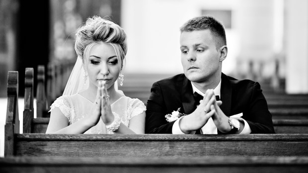 BRIDE AND GROOM PRAYING