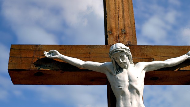 CRUCIFIX AGAINST BLUE SKY